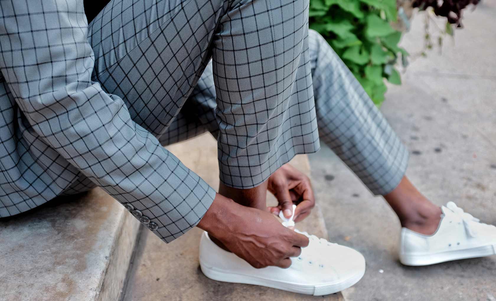 Man tying shoe. Image 3 of 5.