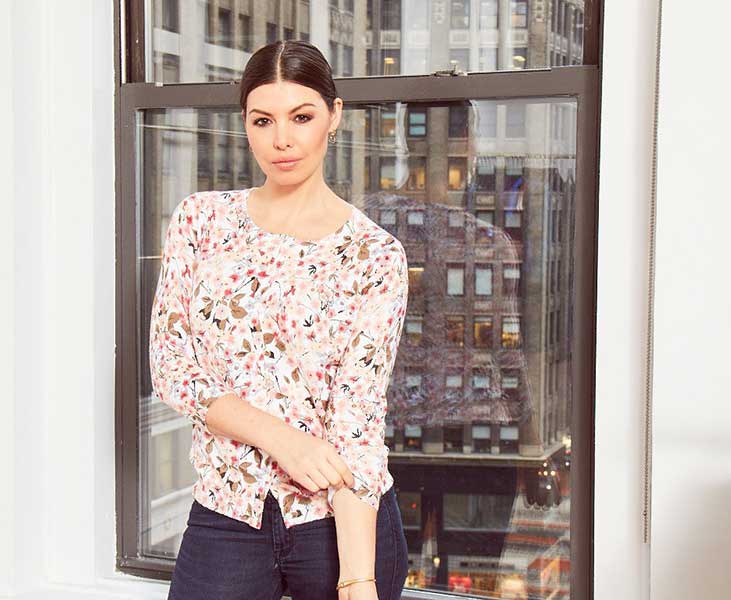 Woman wearing flower patterned blouse